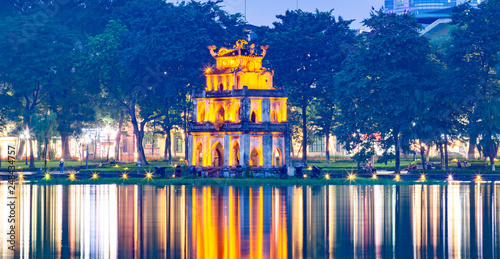 night view of the Turtle Tower in middle of the Hoan Kiem Lake (Lake of the Returned Sword) at historic centre of Hanoi in Vietnam
