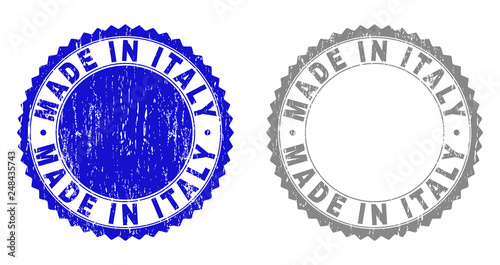 Grunge MADE IN ITALY stamp seals isolated on a white background. Rosette seals with grunge texture in blue and grey colors. Vector rubber stamp imprint of MADE IN ITALY caption inside round rosette.