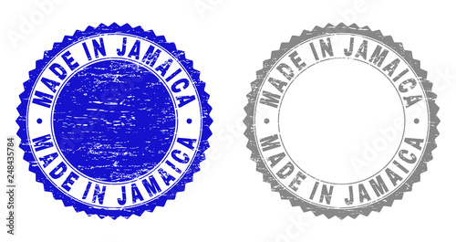 Grunge MADE IN JAMAICA stamp seals isolated on a white background. Rosette seals with distress texture in blue and grey colors. Vector rubber watermark of MADE IN JAMAICA caption inside round rosette.