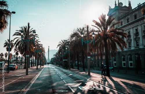 backlighting view of Passeig de Colom and the Columbus statue in Barcelona, Spain. Vanishing point