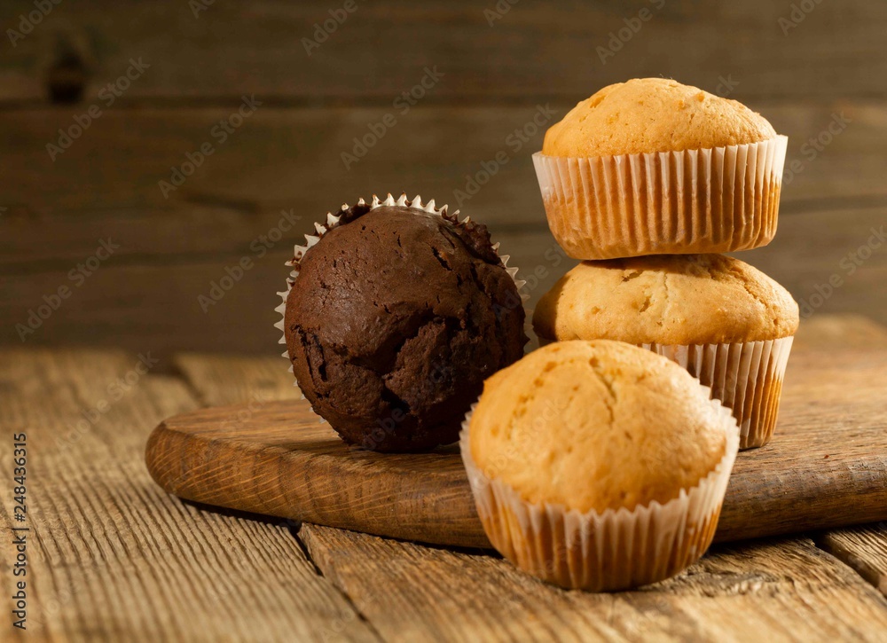 Chocolate cake and nut cake, homemade cakes on wooden background Chocolate cake and nut cake, homemade cakes on wooden background
