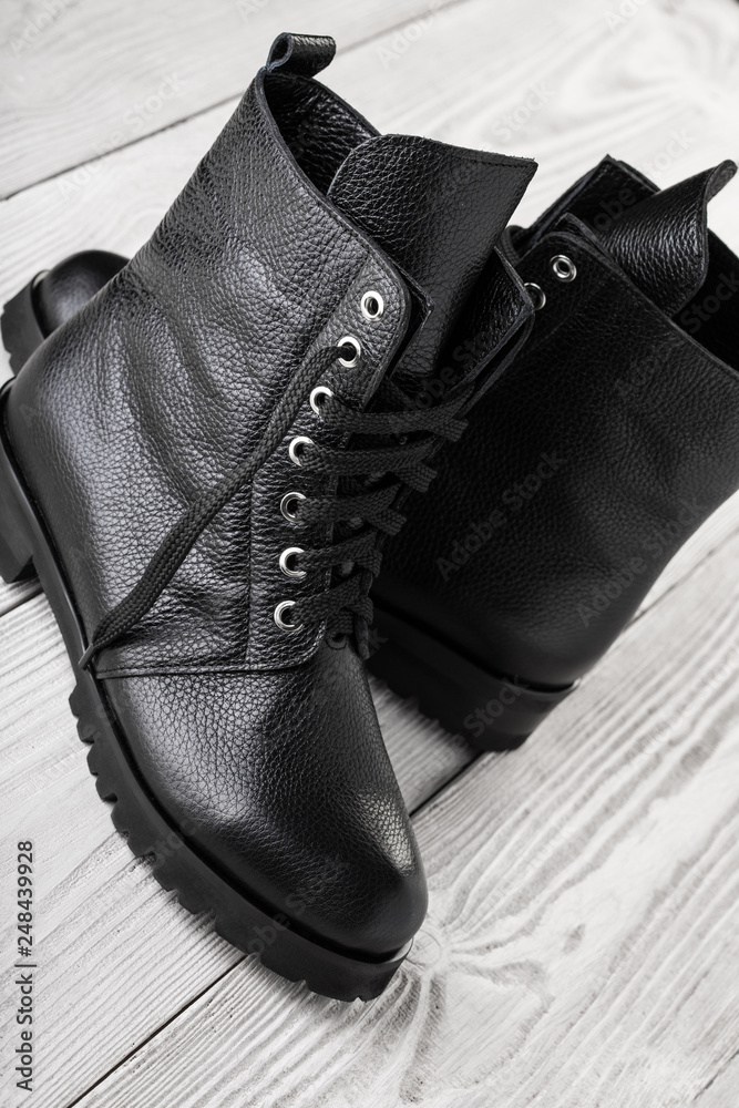 Ladies fashion leather shoes for autumn, spring, European winter. Boots for  a modern grunge woman. Women's black boots with laces isolated on white. Black  Leather Army Boots. Autumn. Fashion. Style. Photos