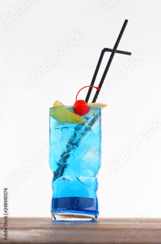 Cold alcohol cocktail with ice cubes photo
