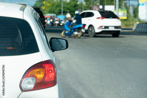 Cars on the road heading towards the goal of the trip, tourism by car, Break in traffic junction. © thongchainak