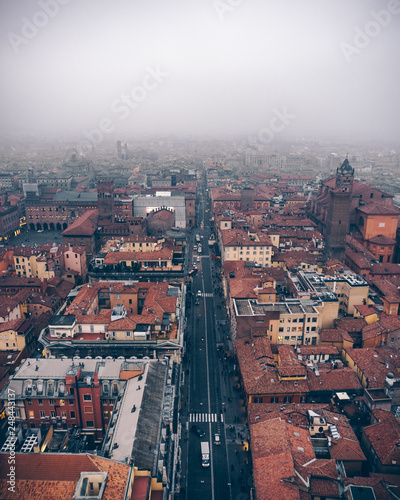 Bird's view of city center of Bologna from the peak of the Two Towers in foggy weather