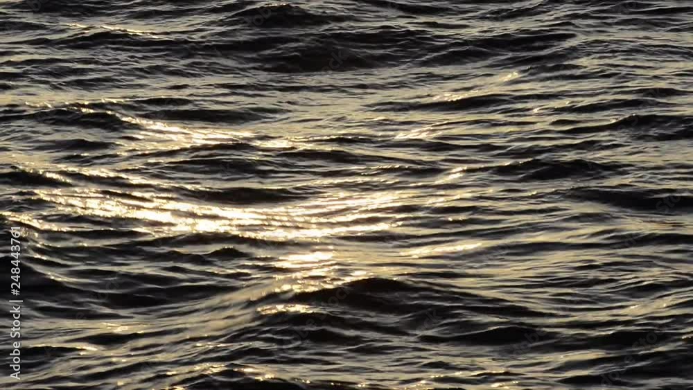 Flowing Dark Blue Waves With Faint Reflection of Setting Sun Flowing Dark Blue Waves With Faint Reflection of Setting Sun