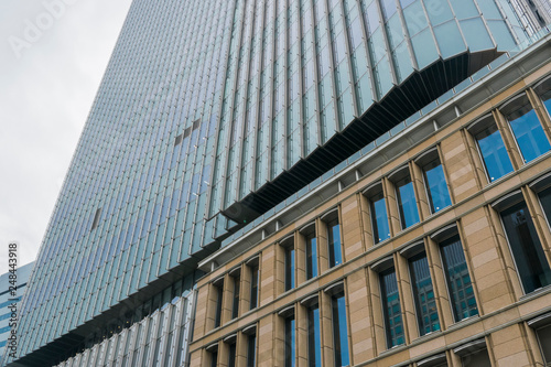 Abstract modern urban blue and gray background featuring details of modern skyscrapers in financial downtown Tokyo, Japan.