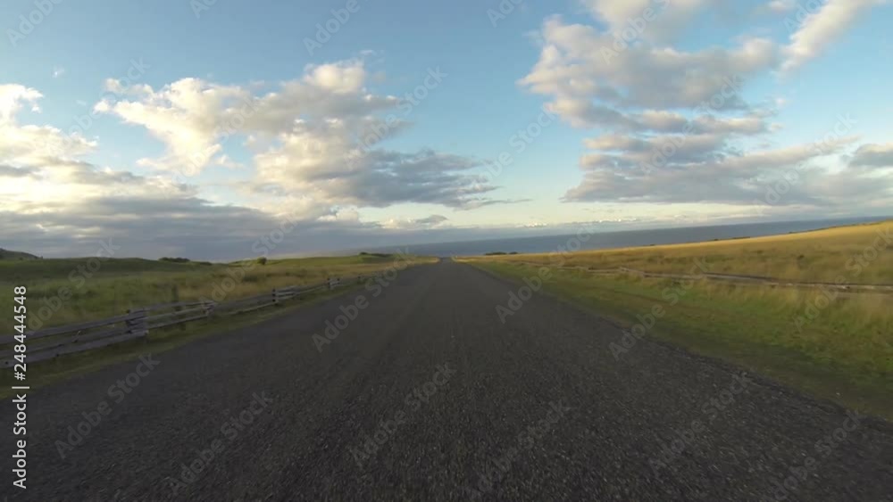 Time Lapse: Driving Through a Deserted Rural Area Between Grassy Fields Time Lapse: Driving Through a Deserted Rural Area Between Grassy Fields