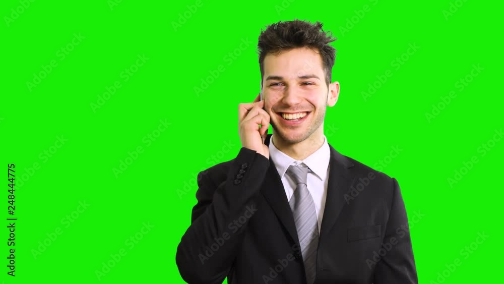 Smiling businessman talking at the phone, chroma key Smiling businessman talking at the phone, chroma key