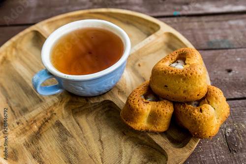 Cup of tea blue tree wooden cake biscuit dessert sweetness tea tea nature flavor flavor