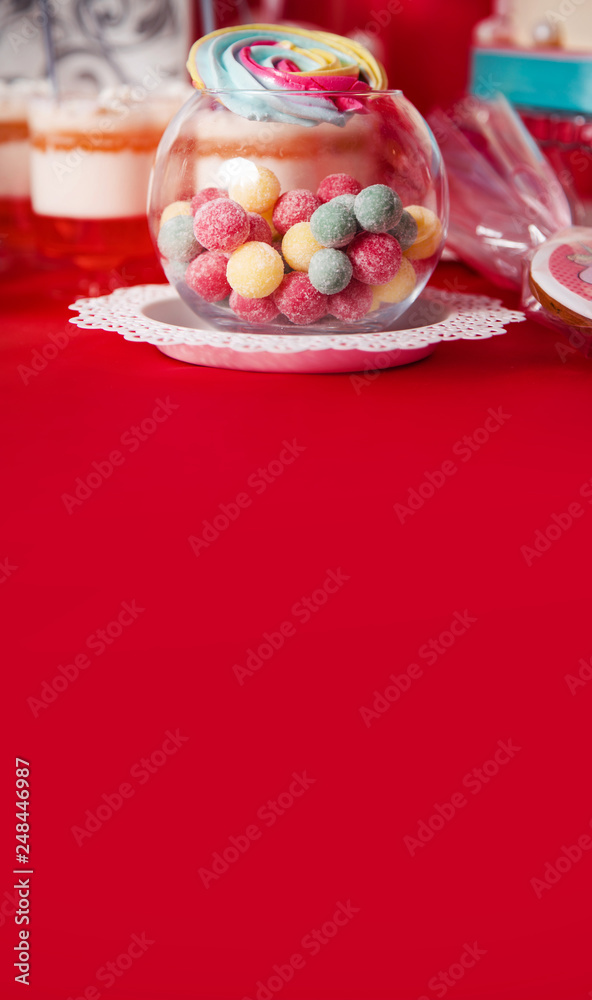First baby girl birthday party concept. Candy bar with sweet unicorn cakes and decor items in bright pink colors. First baby girl birthday party concept. Candy bar with sweet unicorn cakes and decor items in bright pink colors.