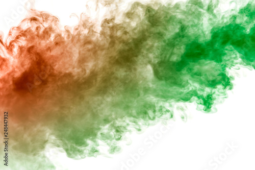 Fototapeta Naklejka Na Ścianę i Meble -  The texture of red smoke is like a watercolor on a white background with transitions of matter between green and orange like a chemical reaction.
