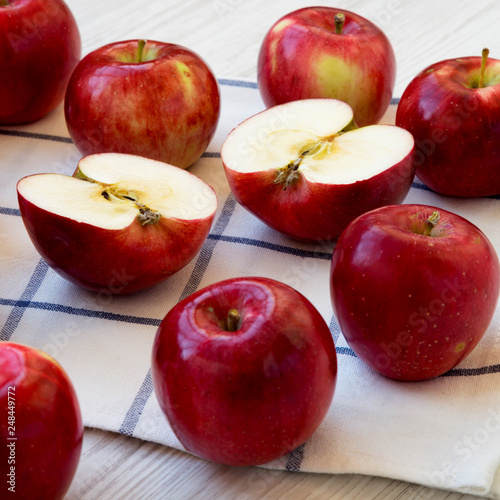 Fresh raw red apples on cloth, side view. Closeup.