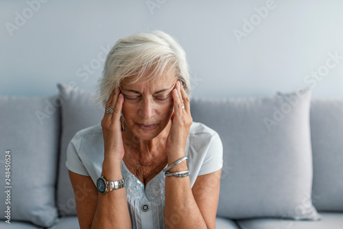 Woman having headache migraine. Stress and depression.