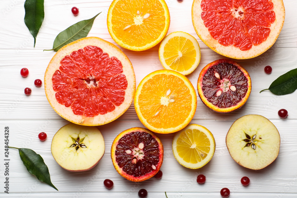 Sliced citrus fruits, vitamins, oranges, grapefruits, lemons, apples, juicy fruits background Sliced citrus fruits, vitamins, oranges, grapefruits, lemons, apples, juicy fruits background