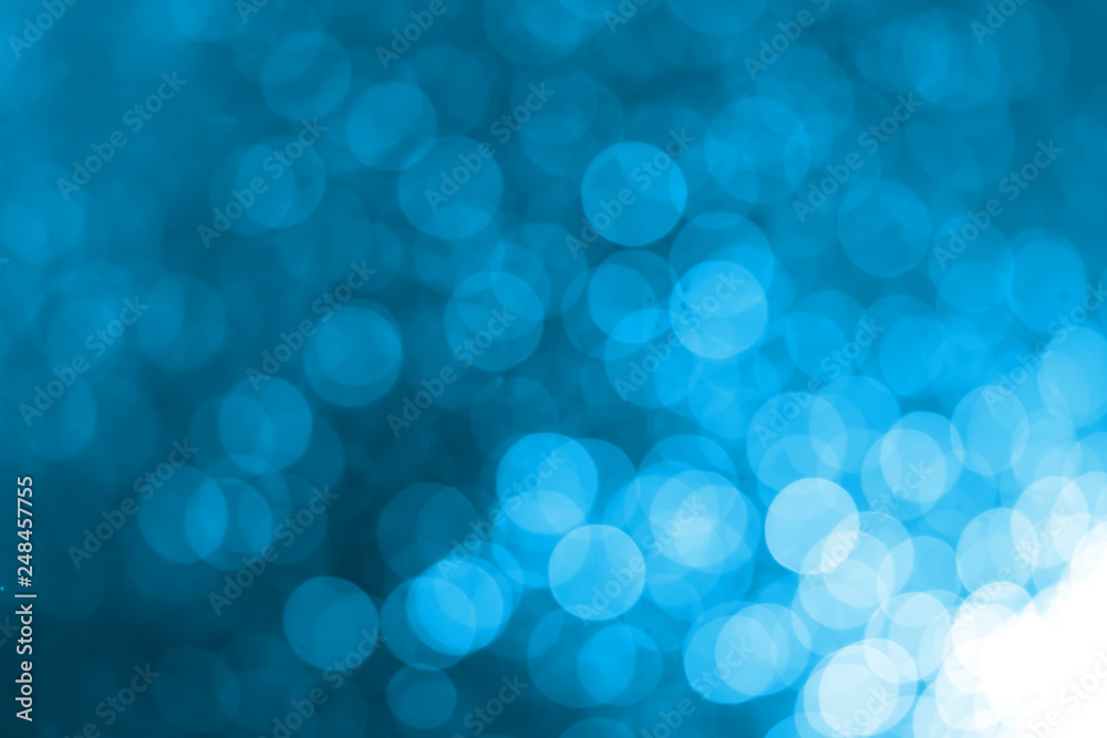 White bokeh on a blue background