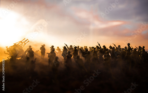 War Concept. Military silhouettes fighting scene on war fog sky background  World War Soldiers Silhouettes Below Cloudy Skyline At night. Attack scene. Armored vehicles. Tanks battle. Decoration