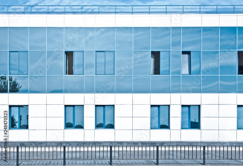 Blue white modern business building. Two-storey building facade
