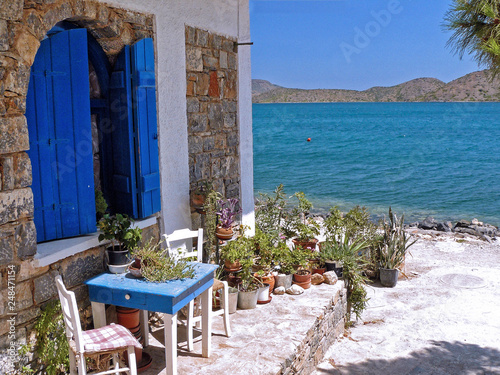 Typical Greek entrance, table and chairs, Elounda, Crete, Greek Islands