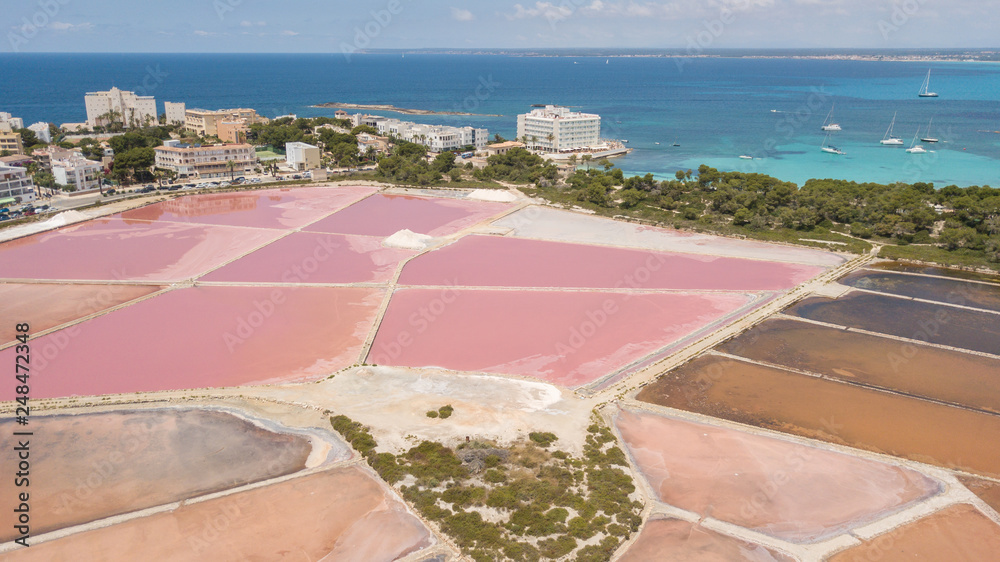 Fototapeta premium Colonia Sant Jordi, Mallorca Spain. Amazing drone aerial landscape of the pink salt flats and the charming beach Estanys