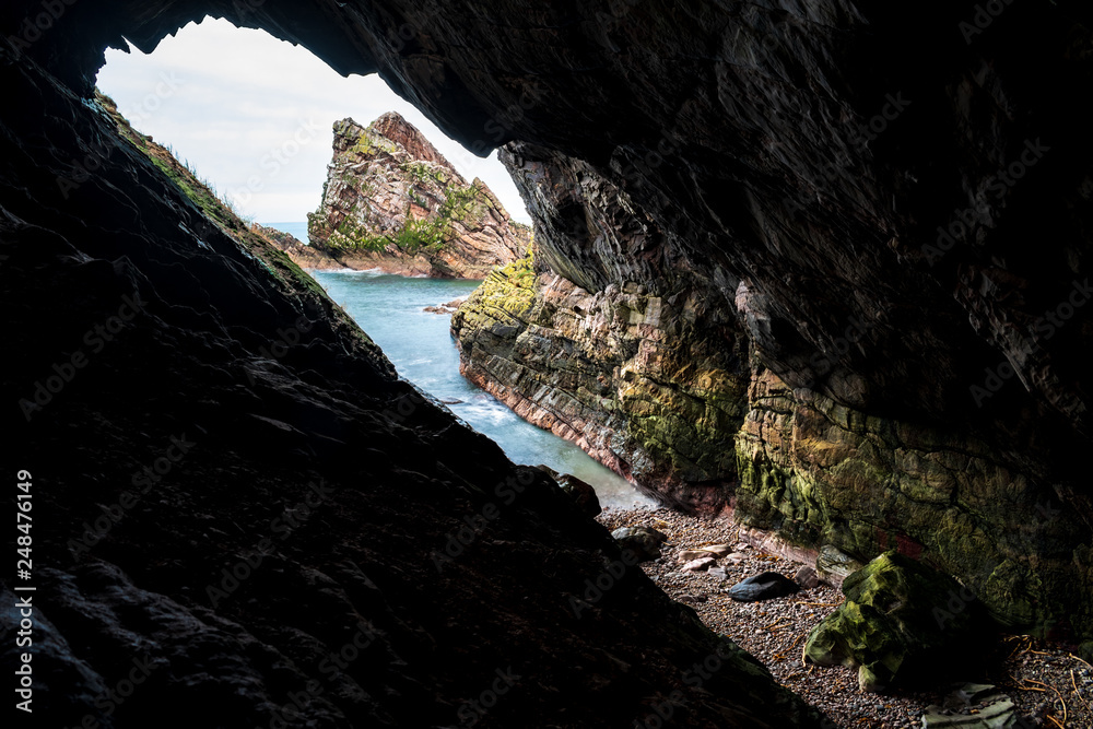 scenic view of sea seen through cave