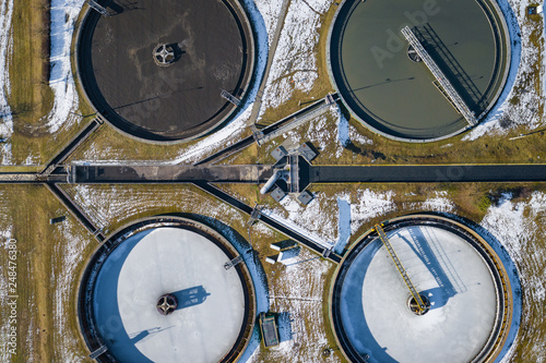 Sewage farm. Static aerial photo looking down onto the clarifying tanks. Industrial place. Geometric background texture. Photo captured with drone. © Curioso.Photography