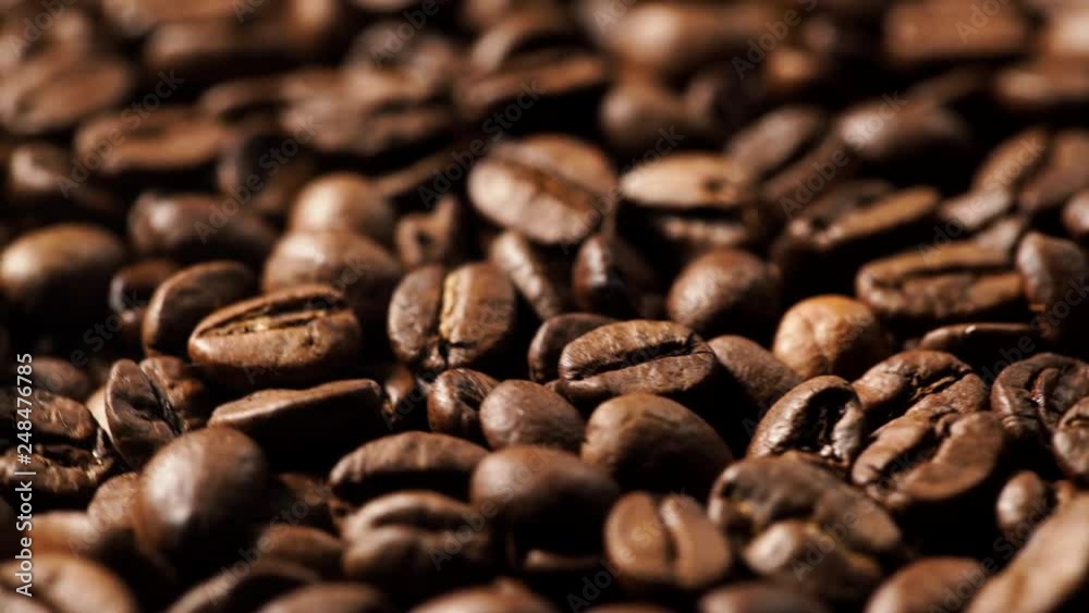 Close up of roasted brown coffee beans rotating Close up of roasted brown coffee beans rotating