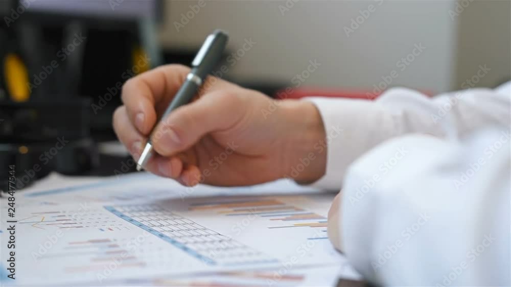 Businessman Working AndTrading With Stock Chart Data. Investment And Financial Concept. Businessman Working AndTrading With Stock Chart Data. Investment And Financial Concept.