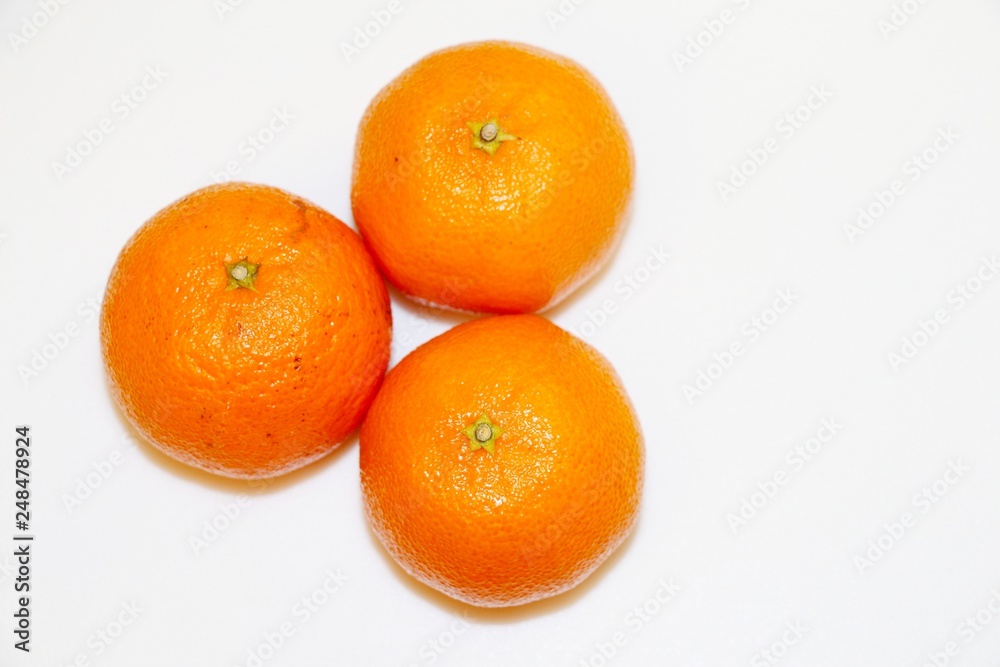 Three mandarins isolated on white background and space for your text. Three mandarins isolated on white background and space for your text.