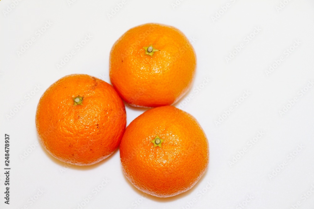Three mandarins isolated on white background and space for your text. Three mandarins isolated on white background and space for your text.