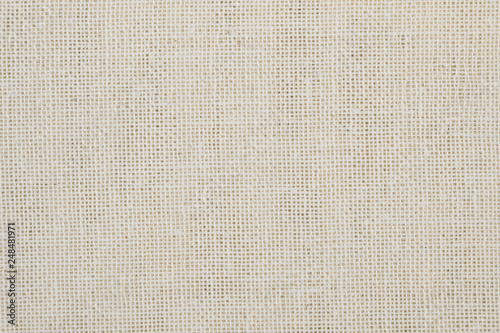 texture of rough linen fabric beige color, closeup