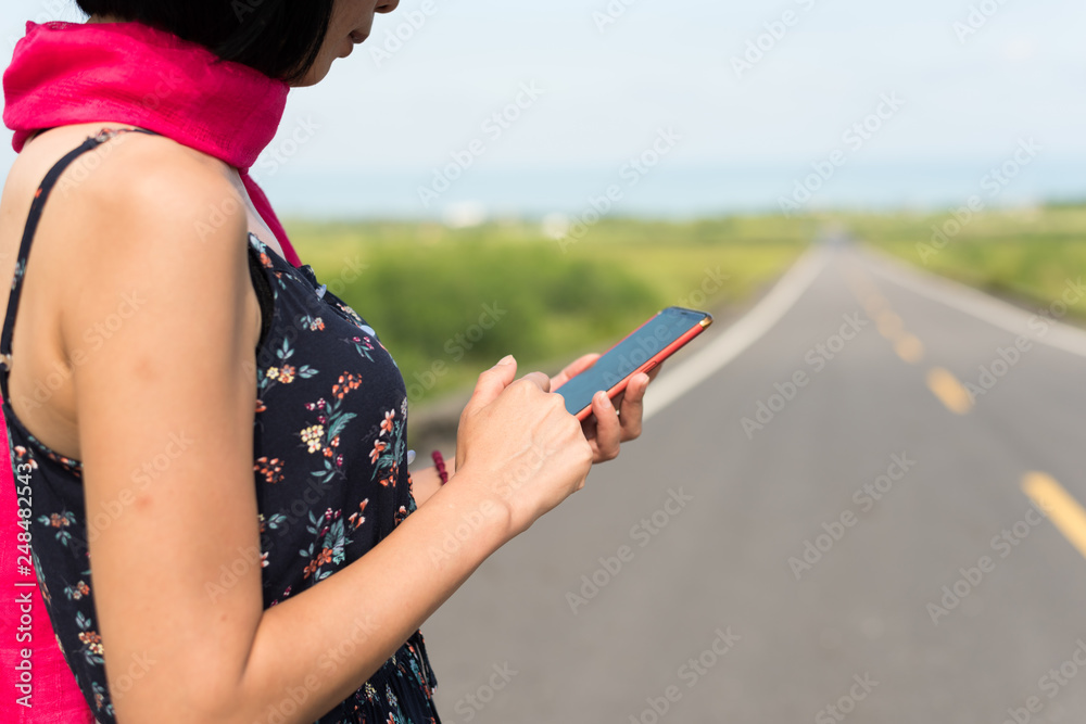 woman walk and use a cellphone