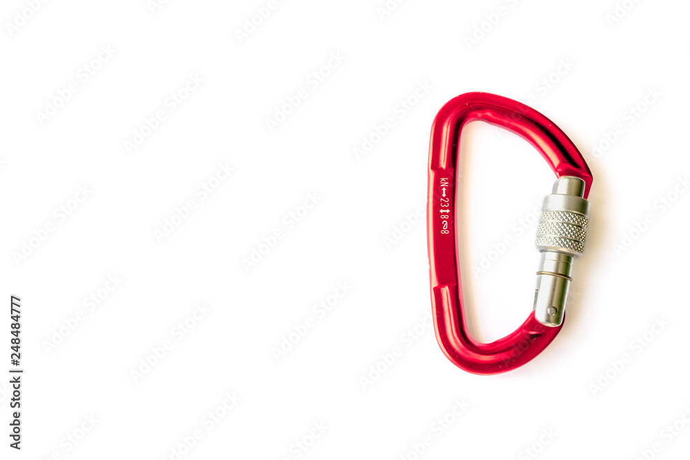 Red locking karabiner done up, isolated on white background, with copy space. Close up of locking carabiner. Basic climbing gear.
