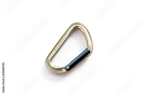 Obraz na płótnie Silver solid straight gate carabiner (karabiner) used for rope clipping, centered and isolated on white background, with discrete shadow and copy space. Basic climbing gear with axis strength ratings. w salonie
