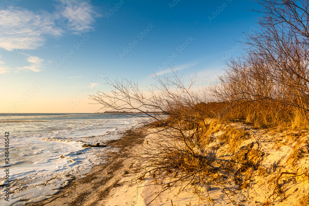 Sandy beach in the Hel Peninsula. Cold winter evening in Jastarnia. Poland.