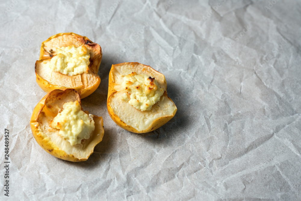 baked apples with curd on white paper. copy space. flat-lay baked apples with curd on white paper. copy space. flat-lay