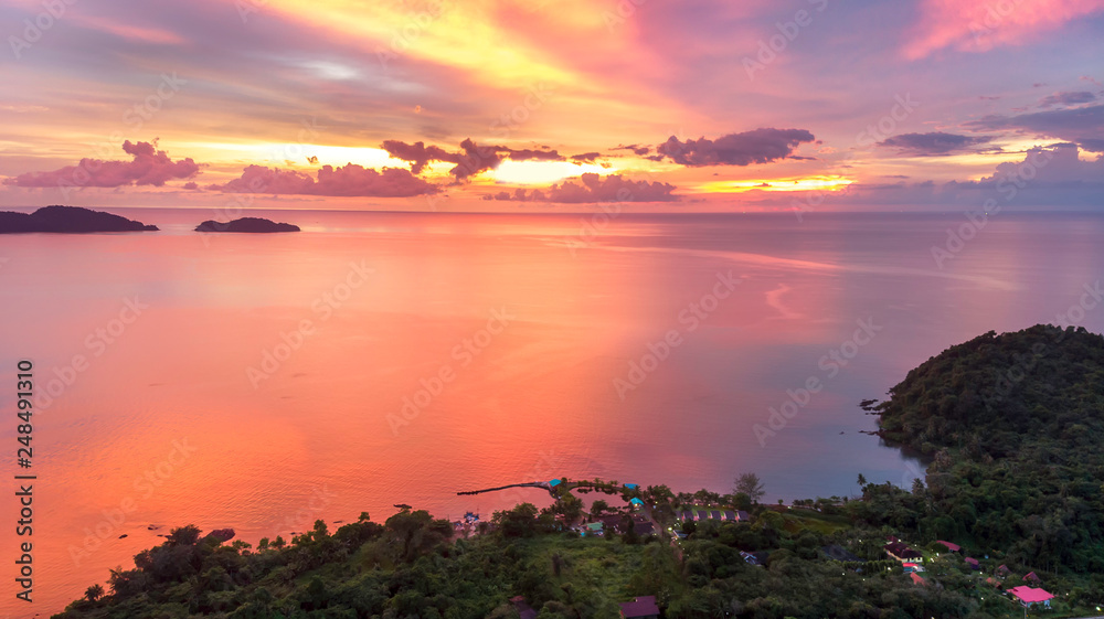 Evening time at patong bay city when the sun disappear with colorful twilight skyline and night light. After sunset at patong bay,high angle view.