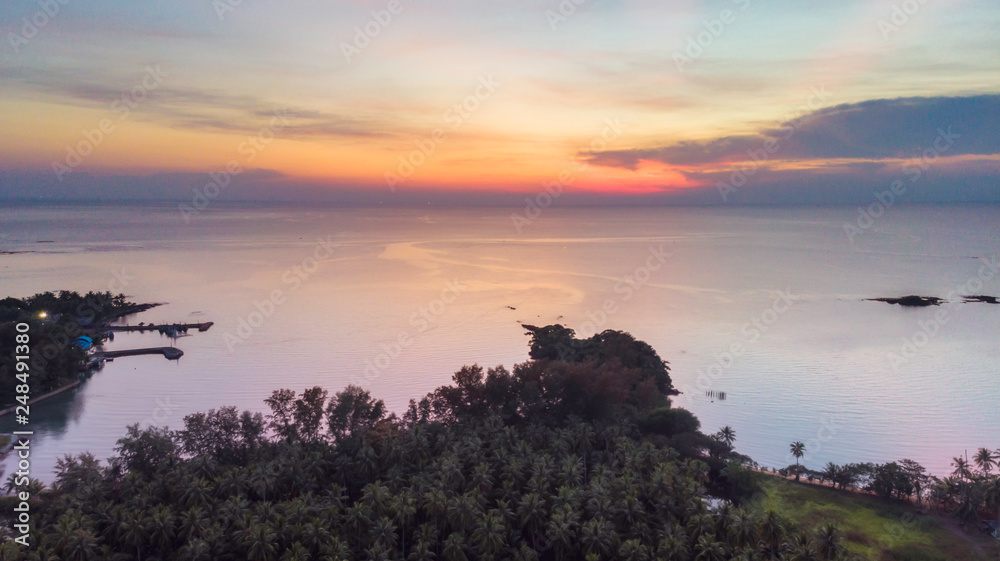 Evening time at patong bay city when the sun disappear with colorful twilight skyline and night light. After sunset at patong bay,high angle view.