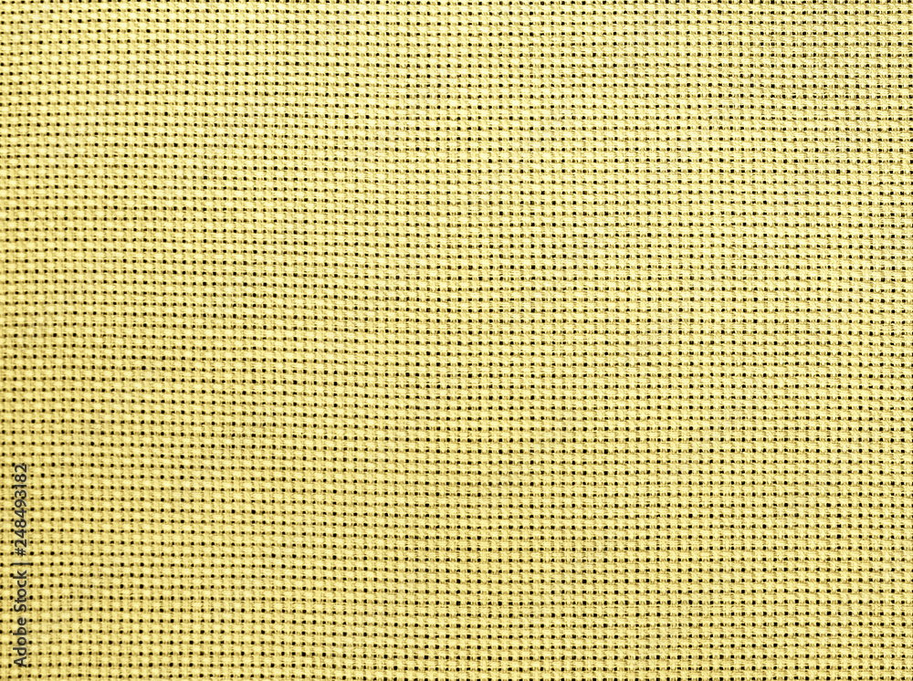 The textured yellow-beige natural fabric. The textured yellow-beige natural fabric.