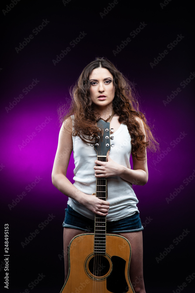 woman holding a guitar