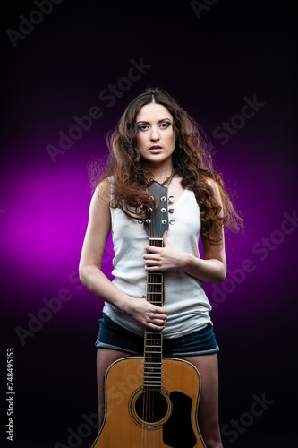 woman holding a guitar