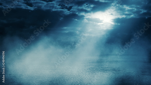 Background scene of empty street. Night view of the river  the night sky with clouds  the reflection of light on the water. Smoke fog