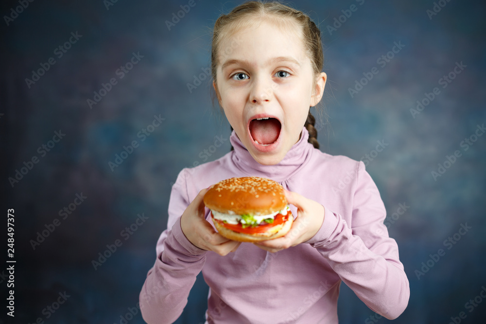 Beautiful Cute Little Caucasian Blond Girl With Hamburger Beautiful Cute Little Caucasian Blond Girl With Hamburger
