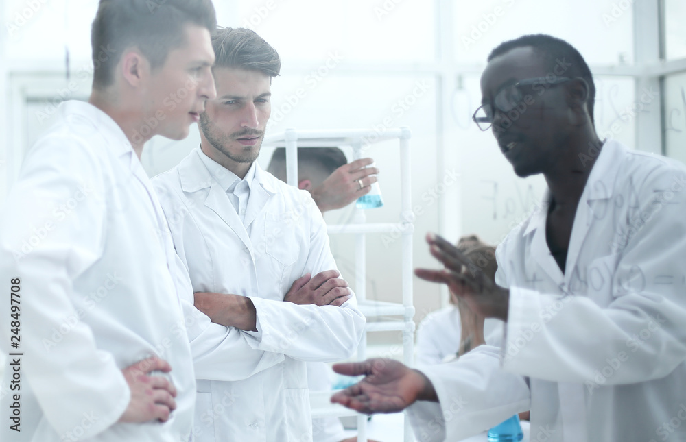 Team of biologists researchers working in laboratory Team of biologists researchers working in laboratory