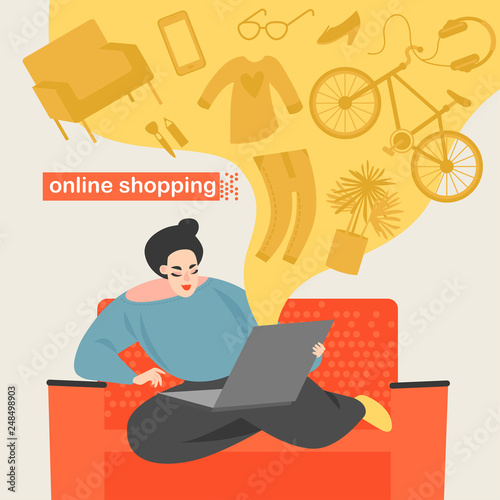 Cute girl makes online shopping while sitting at home on the couch