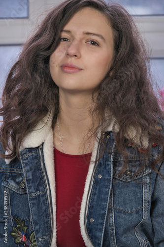 Beautiful attractive girl in a denim jacket