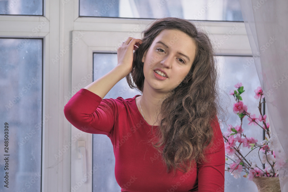 Beautiful attractive girl in a red dress