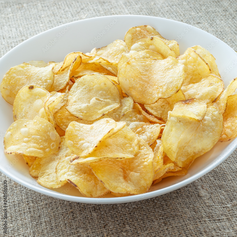 Delicious potato chips with salt Delicious potato chips with salt