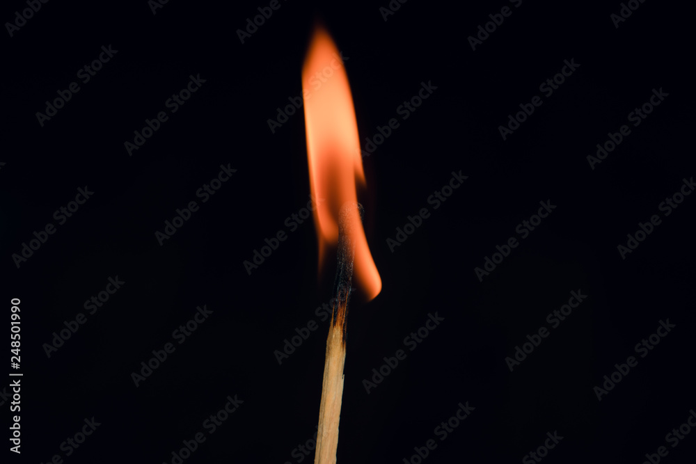 Match burning in the dark