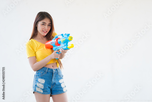 Asian sexy woman with water in hand on white background Festival songkran day at thailand The best of festival of thai Land of  smile